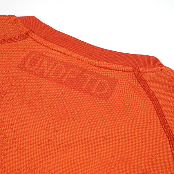 adidas | x UNDEFEATED Knit T-Shirt Orange - Concrete